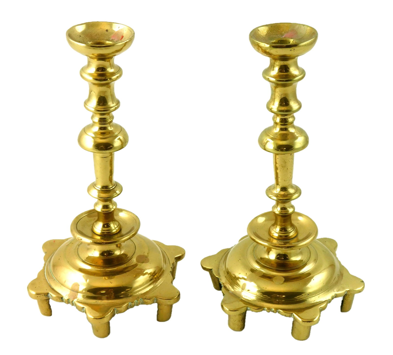 Pair 18th C. Russian sabbath candlesticks, brass, raised on six feet, six pointed pedestal, wear (1 of 2)