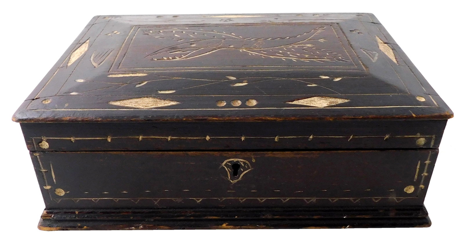 Box, American 19th C., dark stain with white in reserves of shallow carving depicts naÃ¯ve eagle: Box, American 19th C., dark stain with white in reserves of shallow carving depicts naÃ¯ve eagle with initials SB on lid as well as harp, scattered diamond and other shapes, flat domed lid, molding 