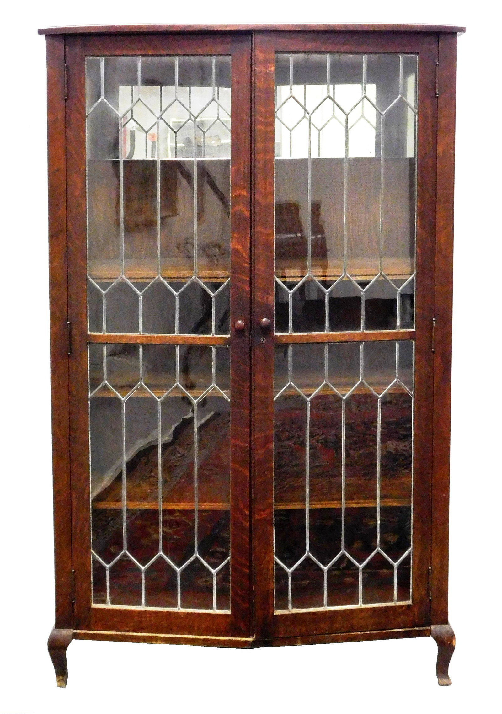 Bookcase, oak with leaded glass panel doors, bow front with four removable shelves, over four raised (1 of 2)
