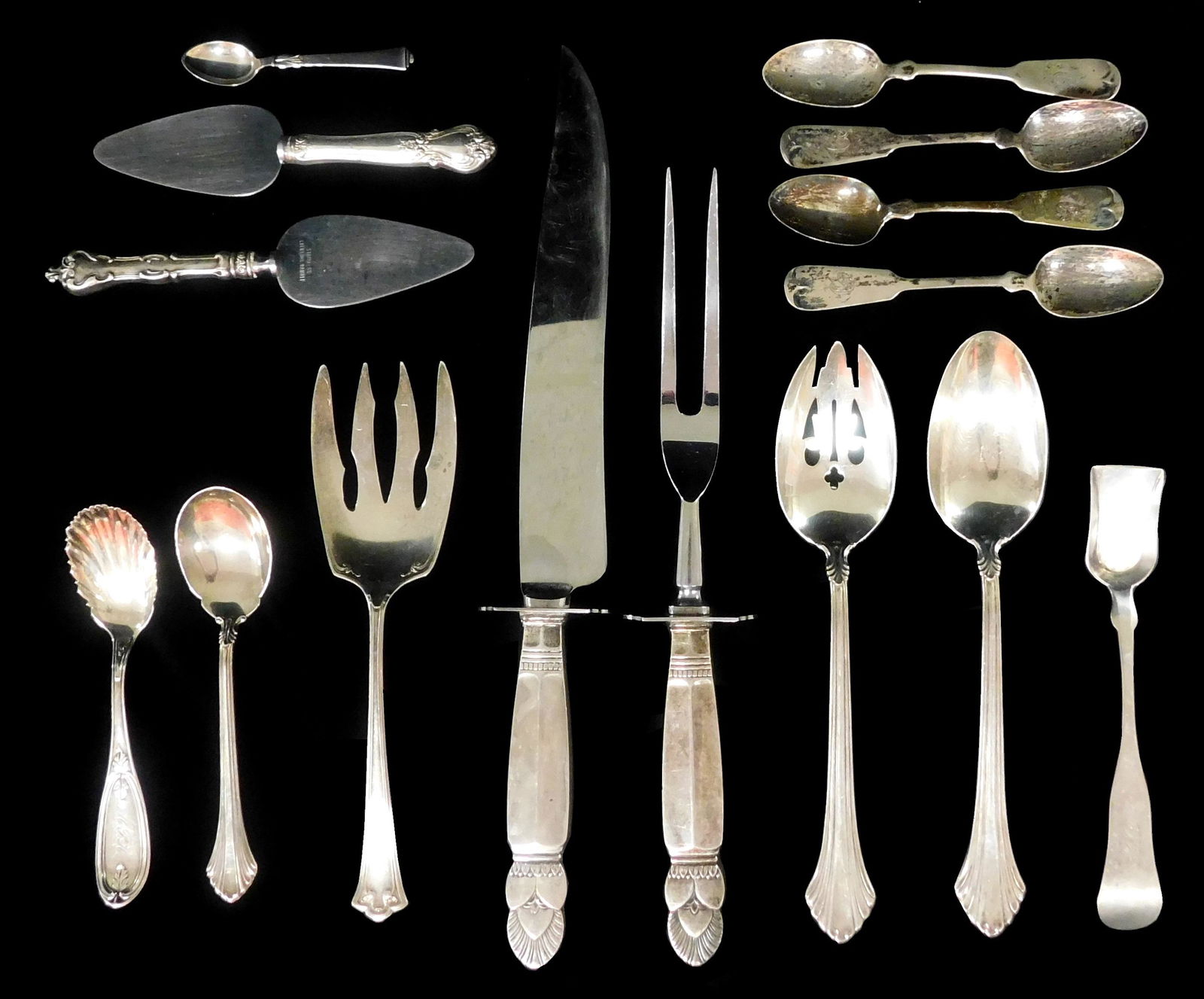SILVER: Fifteen assorted pattern serving pieces, including a carving knife and fork, estimated at .5 (1 of 3)