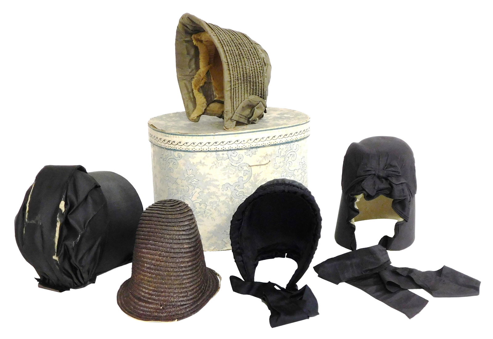 TEXTILE: Five Quaker bonnets, two drawn bonnets, one straw, two silk with long brim and a paper (1 of 5)