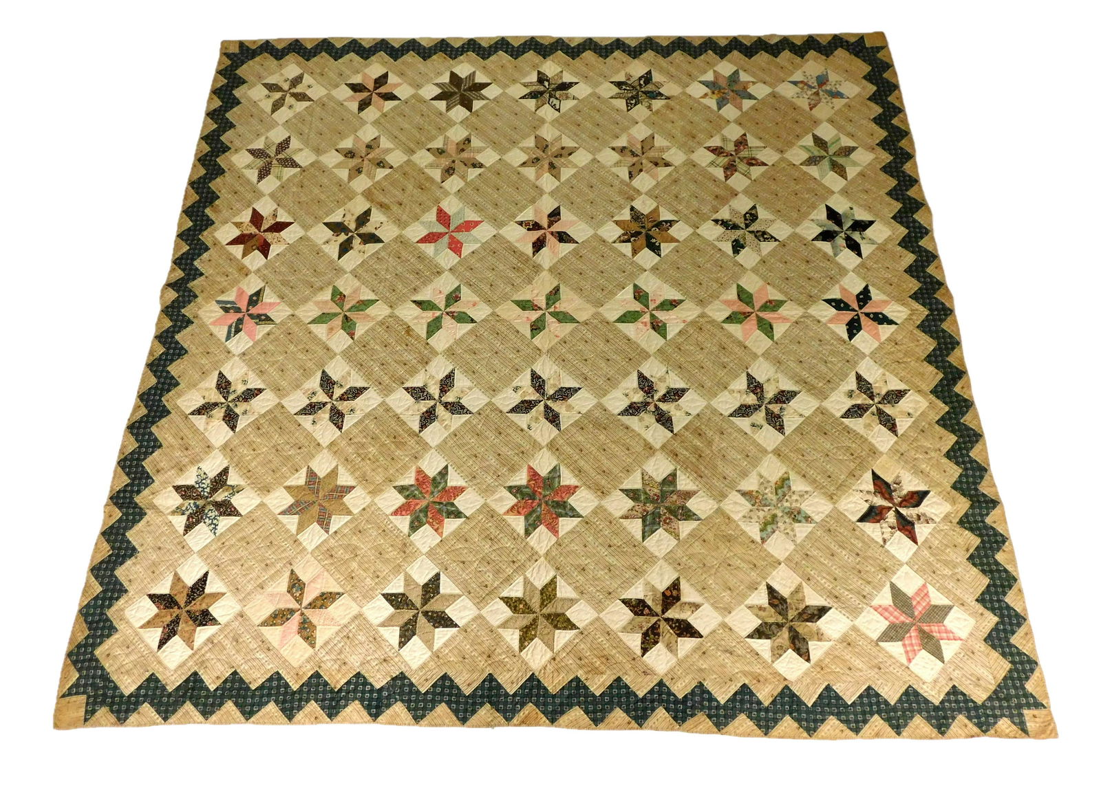 TEXTILE: Pieced cotton calico quilt in an eight-pointed star (LeMoyne Star) pattern, c. 1830s, (1 of 3)