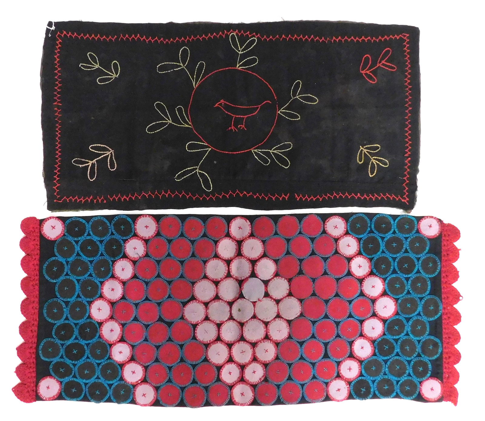 Two table covers: one "penny rug" with black ground, turquoise and red embroidery, 44" l. x 19" w.;: Two table covers: one "penny rug" with black ground, turquoise and red embroidery, 44" l. x 19" w.; the second embroidered black ground with center bird, 38" l. x 19" w., poor condition, sold as is.