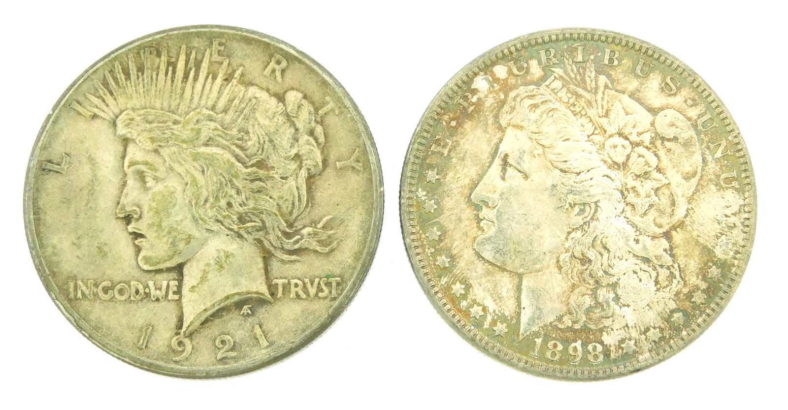 COINS: Lot of two silver dollars. Includes a 1921 Peace dollar in Very Fine-30, and an 1898 Morgan (1 of 2)