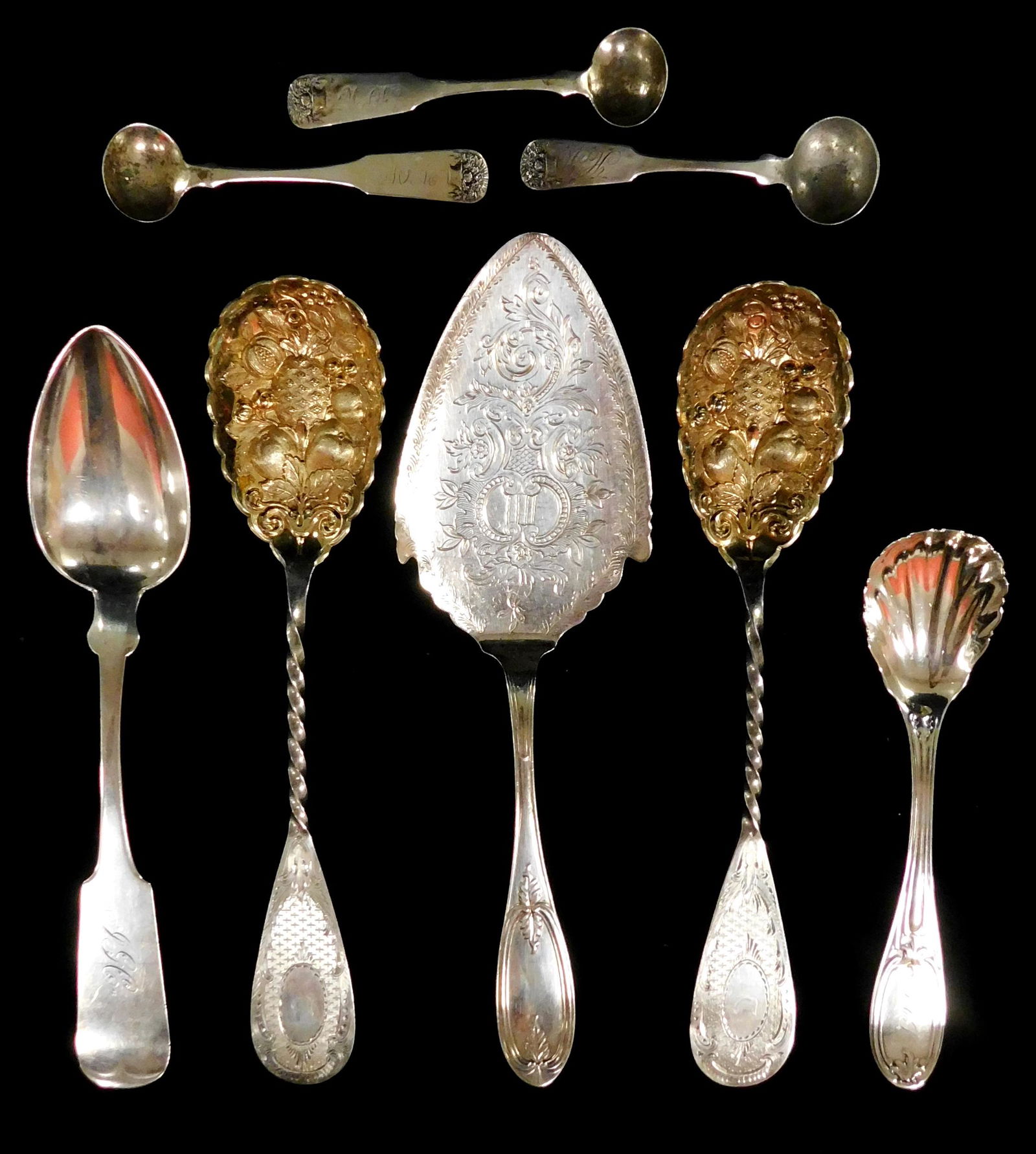 SILVER: Eight pieces of silver serving wear, including two berry spoons with gilt wash and repousse (1 of 3)