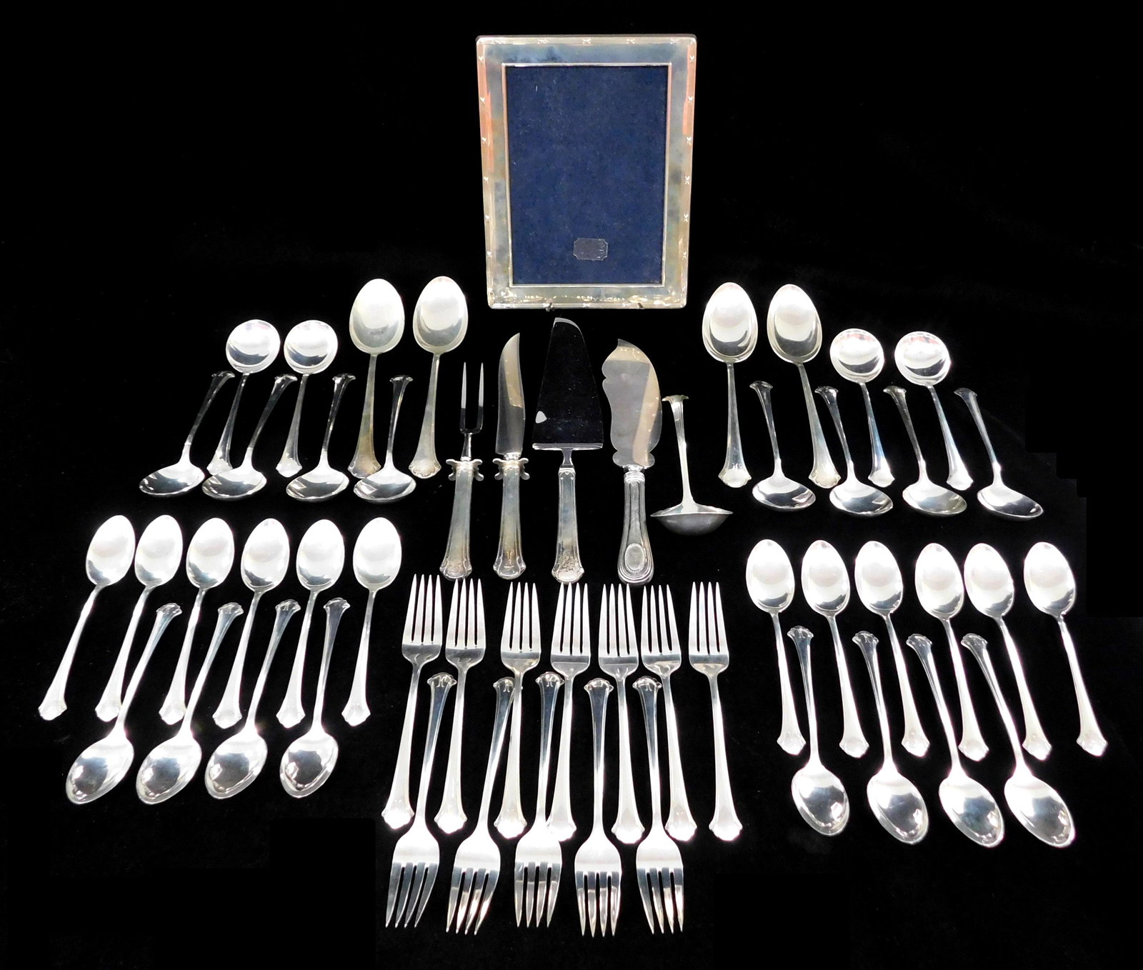 STERLING: Fifty-four pieces of sterling flatware including: fifty-one pieces of "Chippendale" (1 of 3)