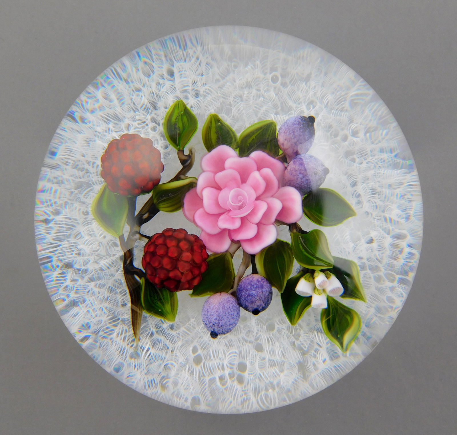 ART GLASS: Victor Trabucco (American, b. 1949), magnum studio glass paperweight with raspberry, (1 of 3)