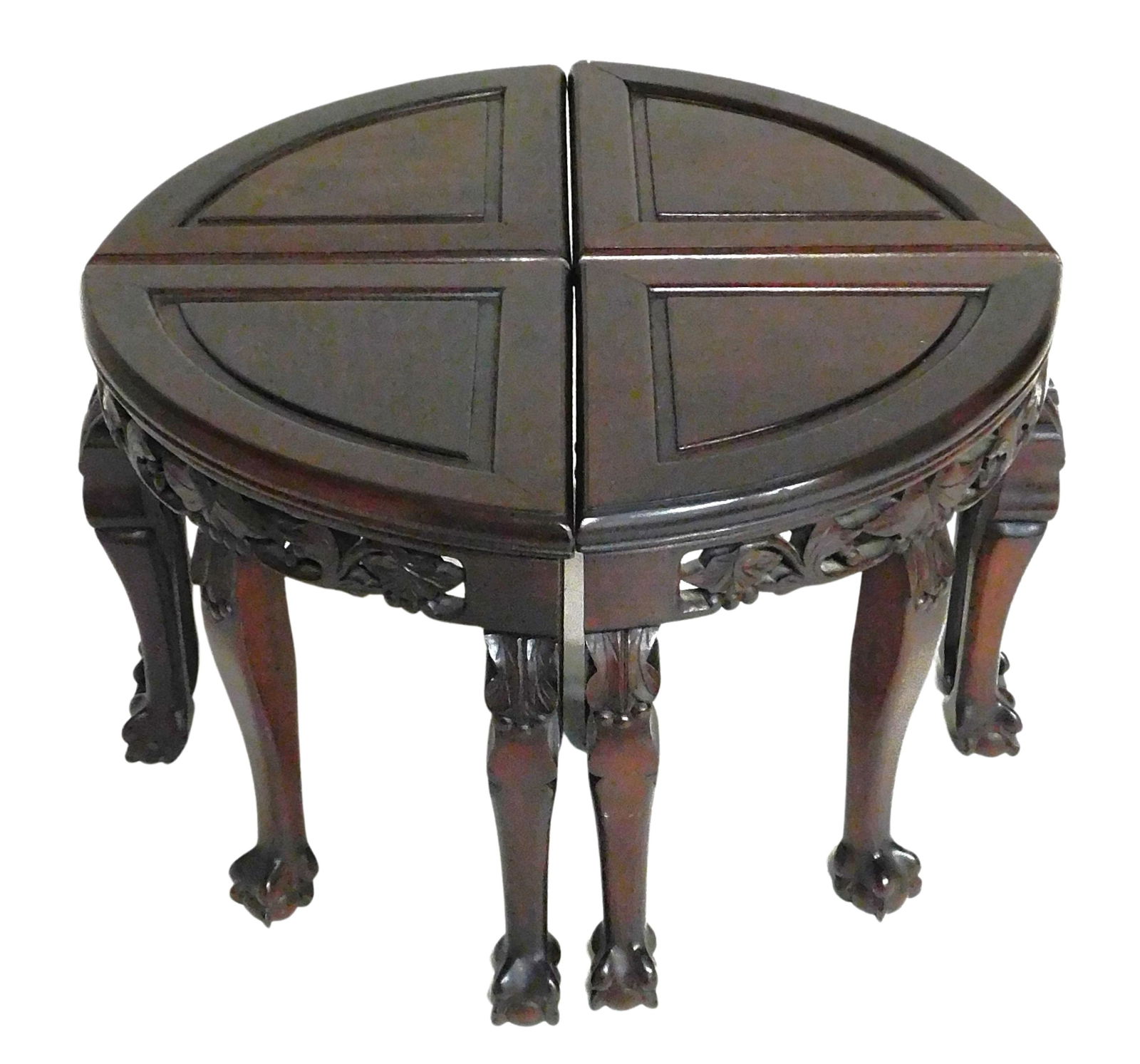 ASIAN: Set of four carved pie shaped stools, Chinese, 20th C., combined they create a low table, (1 of 5)