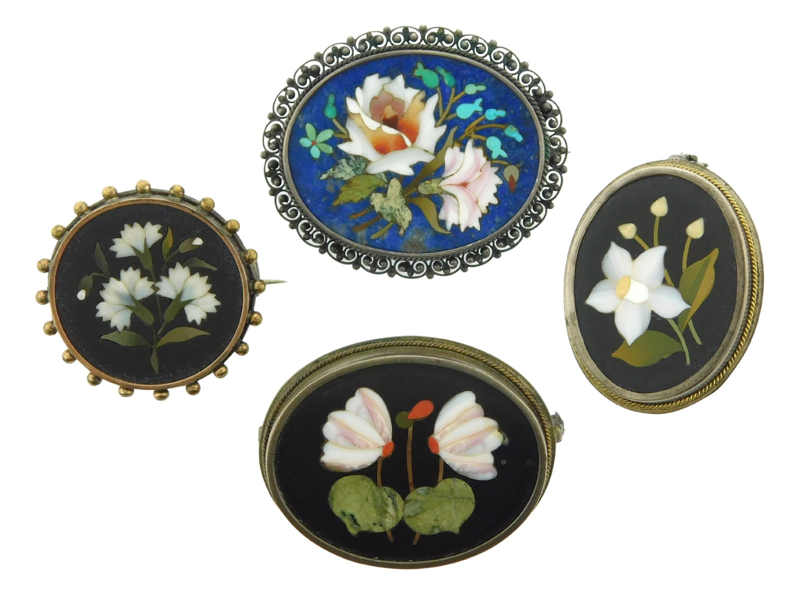 JEWELRY: Four pietra dura pins in silver and silver tone frames, floral motifs including daffodil, (1 of 3)