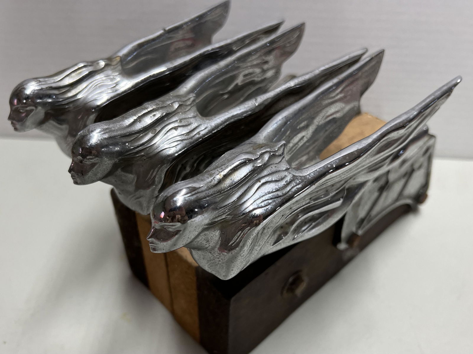 Three 1941 Cadillac era hood ornaments, the winged woman mascot was used as a hood release, mounted (1 of 3)