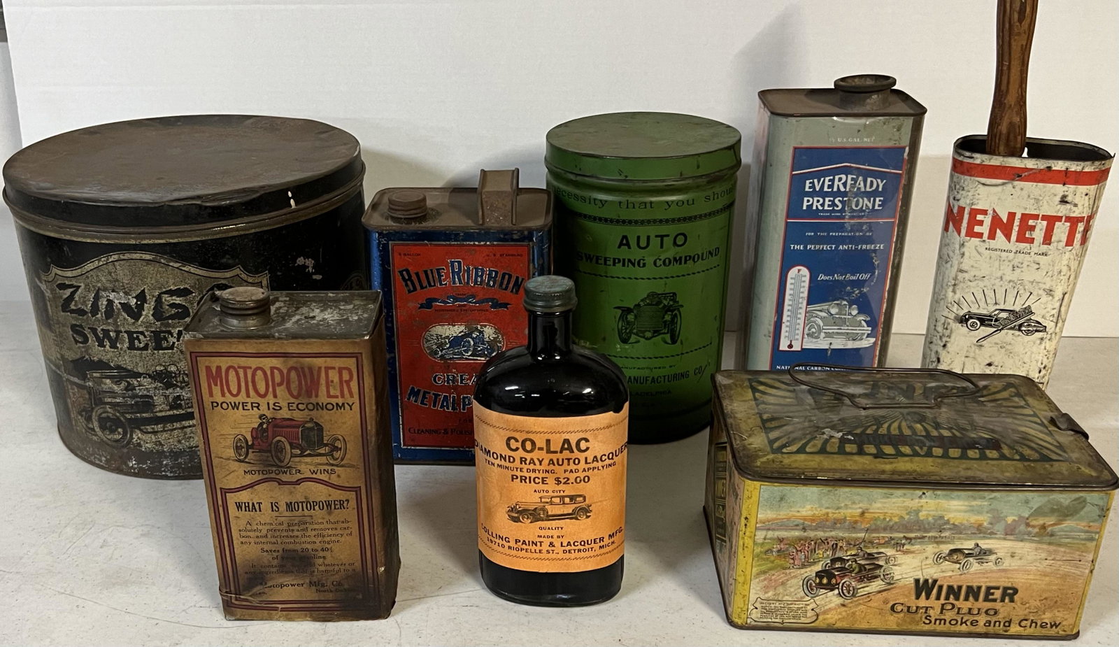 Eight larger containers auto graphics - racing and other auto subjects, older shelf worn condition.: Eight larger containers auto graphics - racing and other auto subjects, older shelf worn condition.