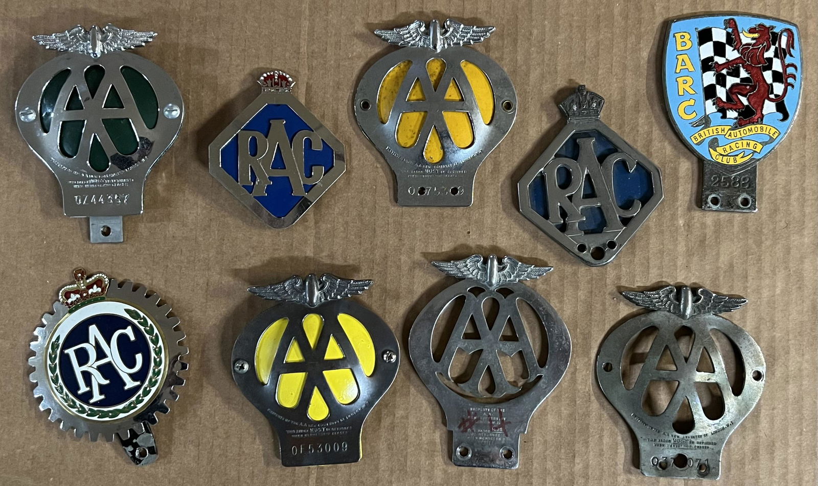 Collection of British auto related badges including an original BARC member badge that mounts on a (1 of 2)