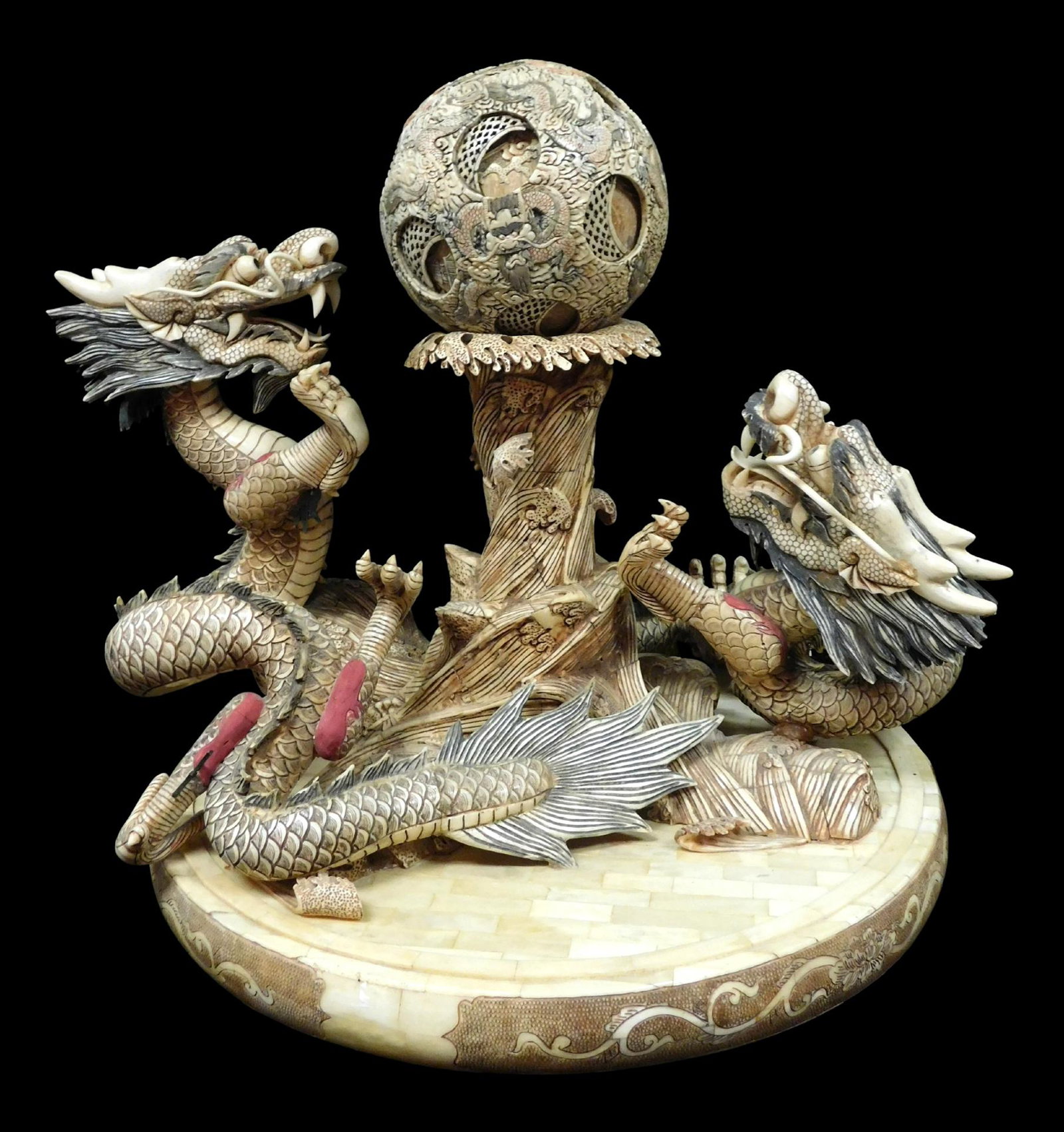 ASIAN: Monumental carved and stained bone figural group, Chinese, 20th C., modeled as two dragons: ASIAN: Monumental carved and stained bone figural group, Chinese, 20th C., modeled as two dragons encircling a central wave in pursuit of a pearl elaborately carved as a puzzle ball, all on a circular