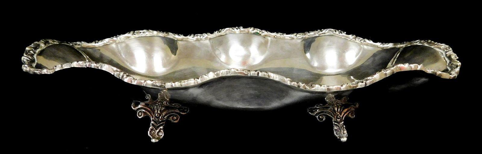 STERLING: Sterling silver oval serving dish, likely American, 20th C., undulating sides trimmed with (1 of 2)