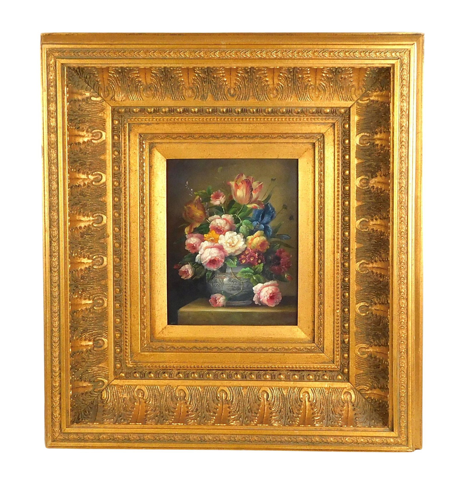 Floral still life in traditional manner, 20th Century, oil on rigid support, depicting multi-colored: Floral still life in traditional manner, 20th Century, oil on rigid support, depicting multi-colored peonies, tulips, irises, and more blossoms in ceramic chinoiserie container, in deep, molded gold f