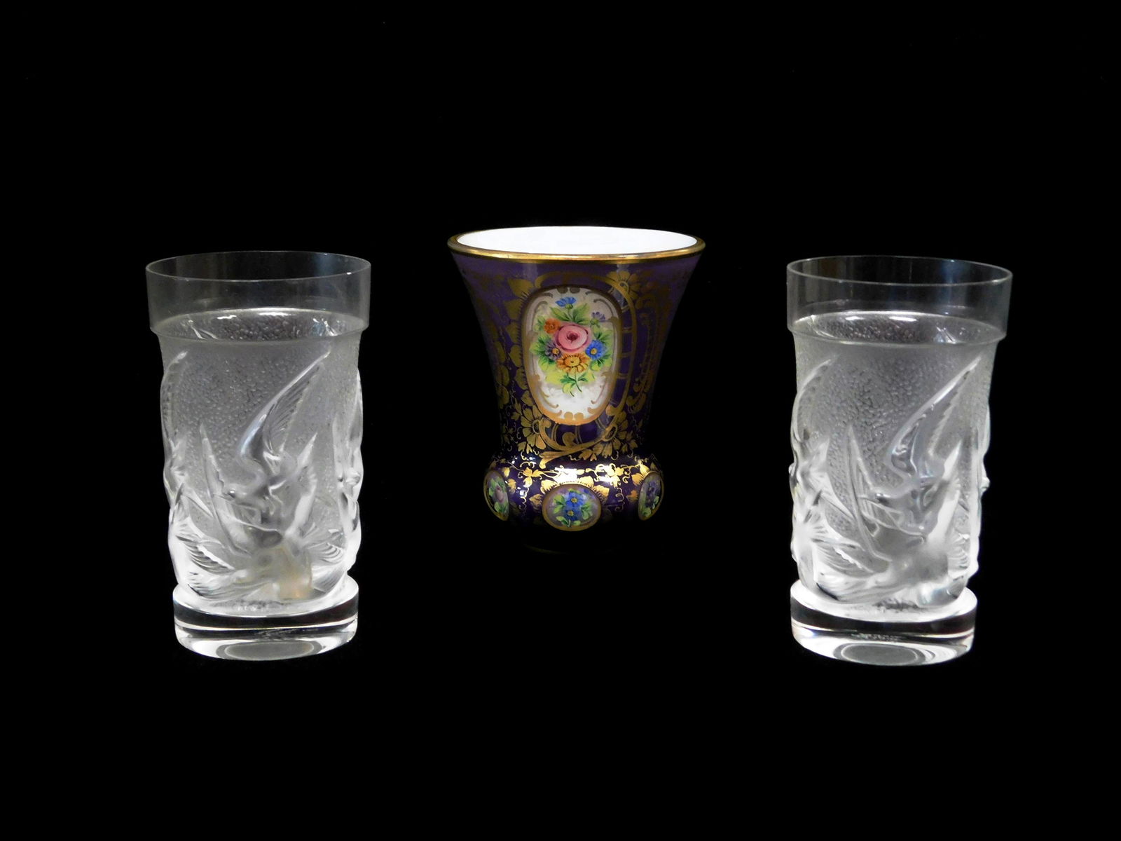 GLASS: Glass vessels, including: two Lalique 'Hirondelles' glass tumblers, raised bird design, mark (1 of 3)