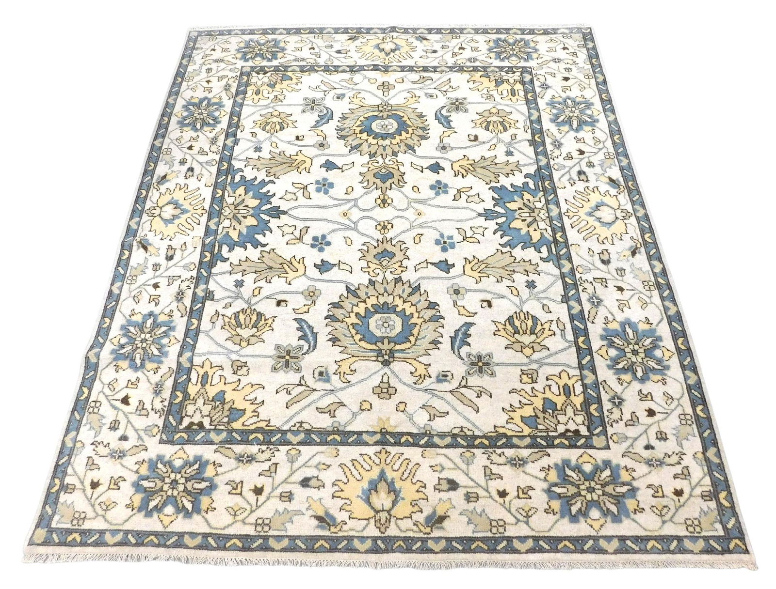 RUG: Turkish Oushak, 8' 2" x 9' 10", hand-made, wool on wool, cream ground, light blue guard border, (1 of 3)