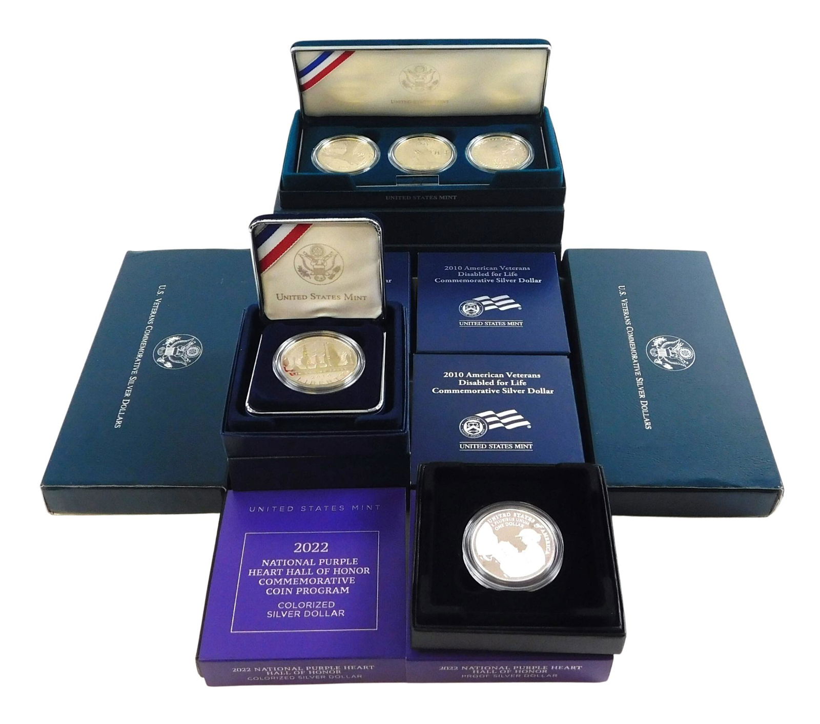 COINS:Nineteen U.S. Mint coins, five 2010 Disabled Vets $1 silver coin proofs; along with four US (1 of 4)