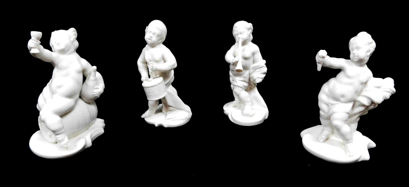 Four Nymphenburg porcelain Blanc de Chine Putti statues, each varying in size and design, maker (1 of 4)