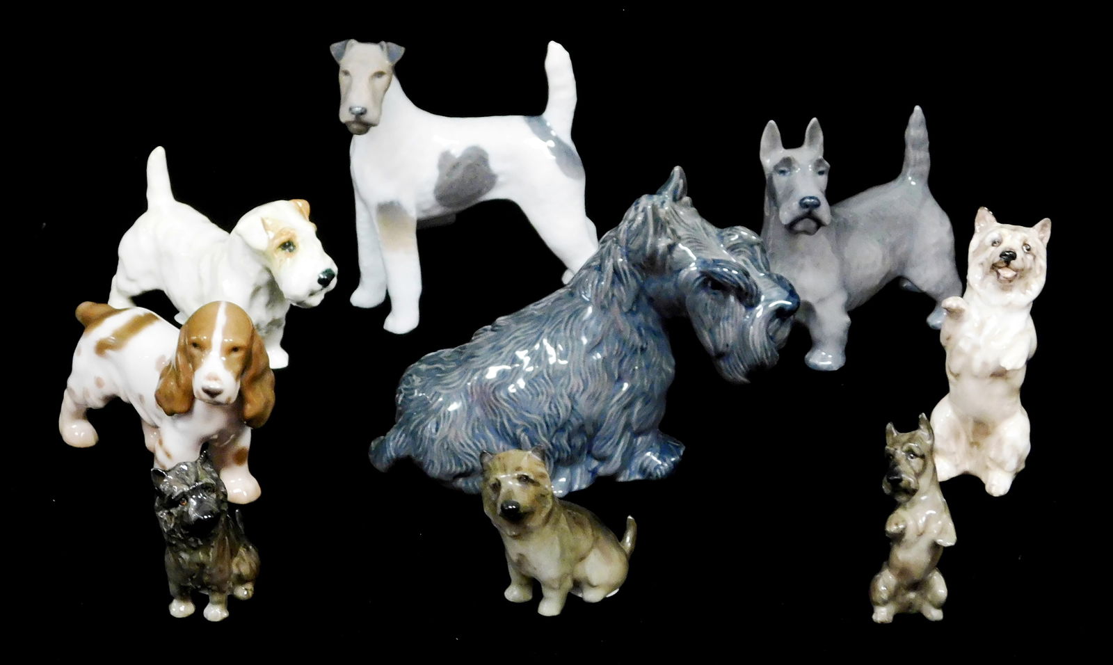 Nine Bing and Grondahl, Royal Copenhagen, and Royal Doulton porcelain dogs, including: one Bing and (1 of 6)