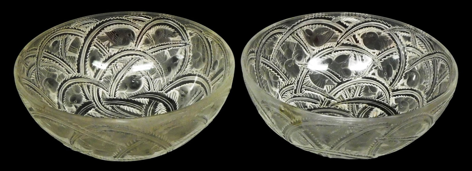 GLASS: Pair of Lalique "Pinsons (Finches)" glass bowls, 20th C., Art Deco pattern with spiraling fol: GLASS: Pair of Lalique "Pinsons (Finches)" glass bowls, 20th C., Art Deco pattern with spiraling foliage and finches in between the branches, etched signature to base "Lalique France", wear consistent