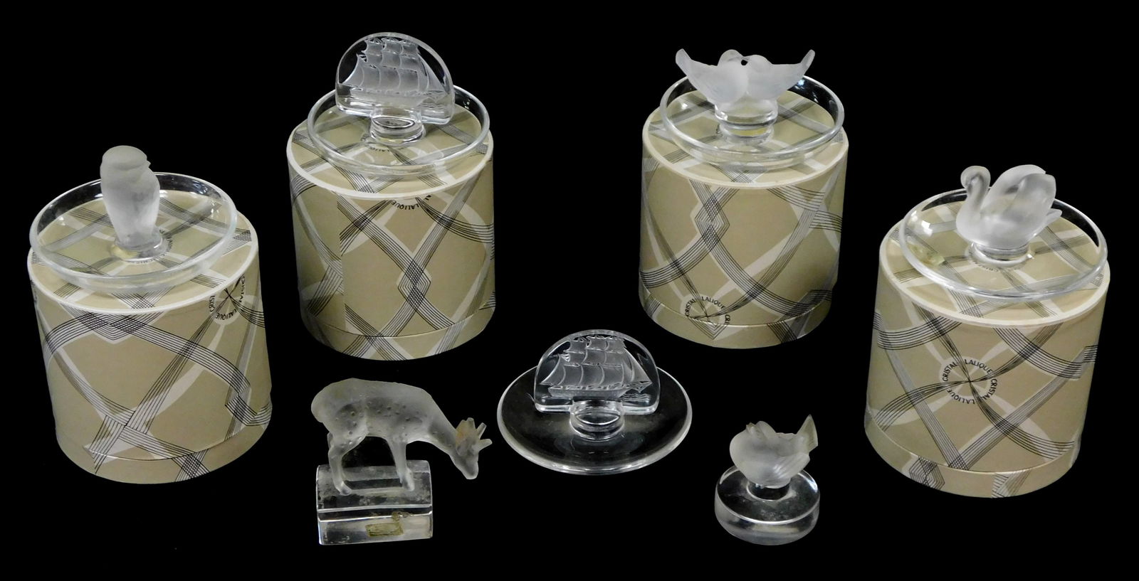 GLASS: Seven Lalique, France ring holders and paperweights, 20th C., four with original packaging, a (1 of 2)