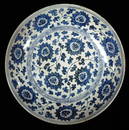 ASIAN: Porcelain charger, Chinese, Ming Dynasty (1368-1644), blue and white scrolling foliate and lo