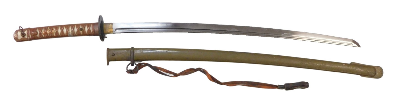 ASIAN: WW2 Japanese Type 95 NCO Shin Gunto in scabbard, c. 1943, 26" blade made for the Japanese Imp: ASIAN: WW2 Japanese Type 95 NCO Shin Gunto in scabbard, c. 1943, 26" blade made for the Japanese Imperial Army during World War Two, matching serial number 111466 ? on scabbard and blade, marks from t
