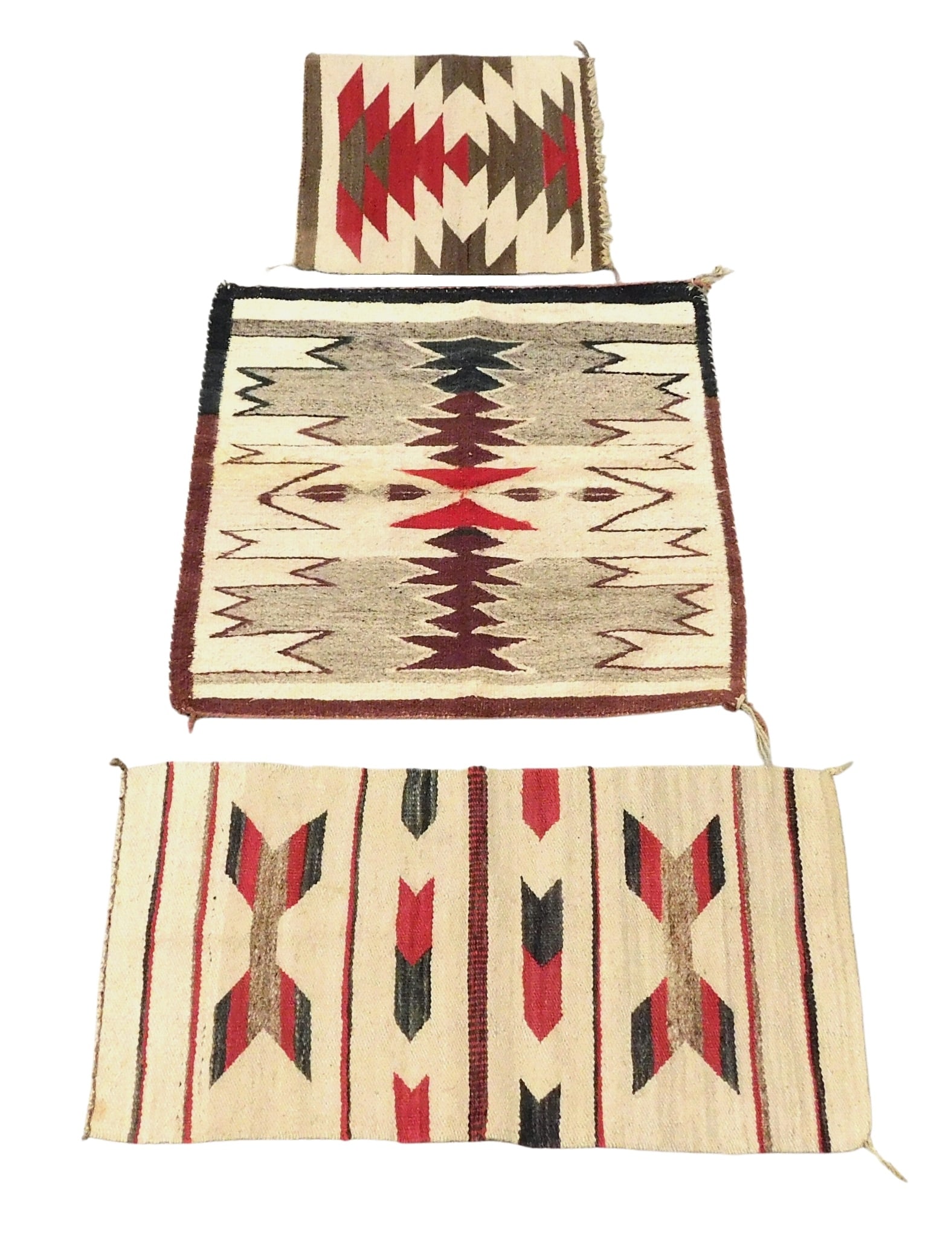 Three Navajo weavings, 20th C., handwoven mats, various colors and sizes with cream grounds, wear co (1 of 7)