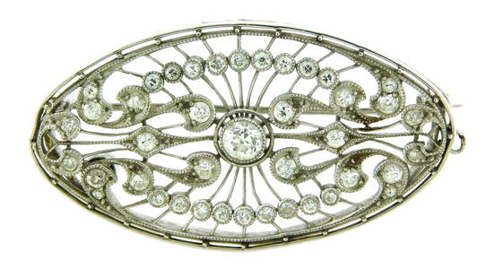 JEWELRY: Edwardian oval filigree diamond brooch, tested platinum, with milgrain, and a mixture of: JEWELRY: Edwardian oval filigree diamond brooch, tested platinum, with milgrain, and a mixture of old European cut and transitional cut diamonds, forty-one diamonds with an ed, “F4992.” 1 &fra