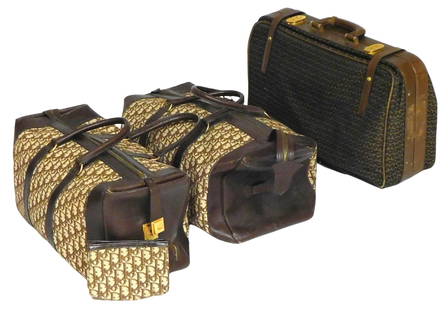 Mark Cross, Christian Dior, Three vintage designer suitcases, including: Mark Cross suitcase,: Mark Cross, Christian Dior, Three vintage designer suitcases, including: Mark Cross suitcase, Italian, with black on brown MC monogram fabric with leather and brass trim, four pockets, one with zipper