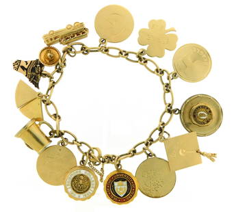 JEWELRY: Charm bracelet, stamped 14K, yellow gold oval link bracelet with spring ring clasp and: JEWELRY: Charm bracelet, stamped 14K, yellow gold oval link bracelet with spring ring clasp and safety chain, containing eleven 14K and three gold filled charms, including 14K yellow gold 'University