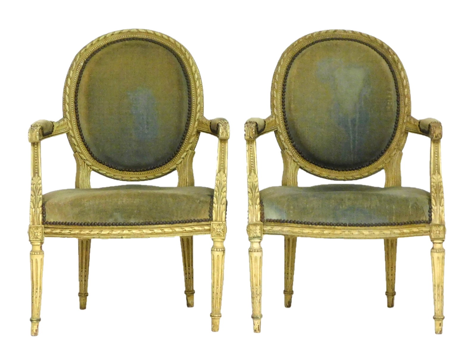 Pair of Louis XVI form armchairs, 19th C., older white paint finish, ballon back with carved ribbon: Pair of Louis XVI form armchairs, 19th C., older white paint finish, ballon back with carved ribbon border, carved throughout with acanthus leaf designs and bead borders, four tapered round legs with 