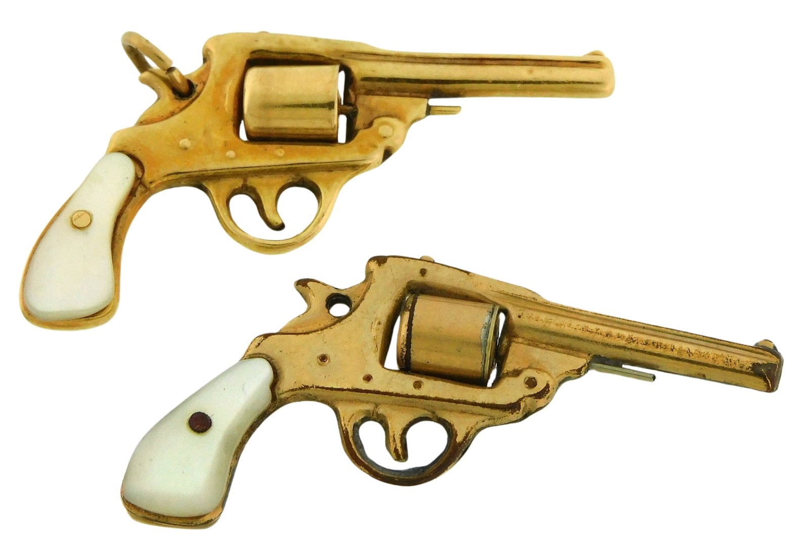 JEWELRY: Two revolver pendants, including: stamped and tested 14K yellow gold revolver, pistol: JEWELRY: Two revolver pendants, including: stamped and tested 14K yellow gold revolver pistol pendant with mother of pearl grip, 4.2 grams; tested gold plated revolver pistol pendant with mother of pe