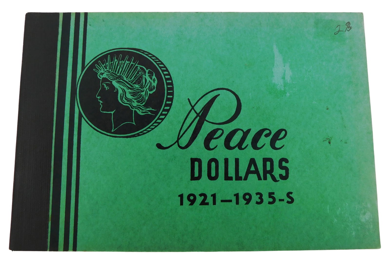 COINS: Group of Peace and 1921 Morgan silver dollars housed in one old Megrig album, thirty-two (1 of 4)