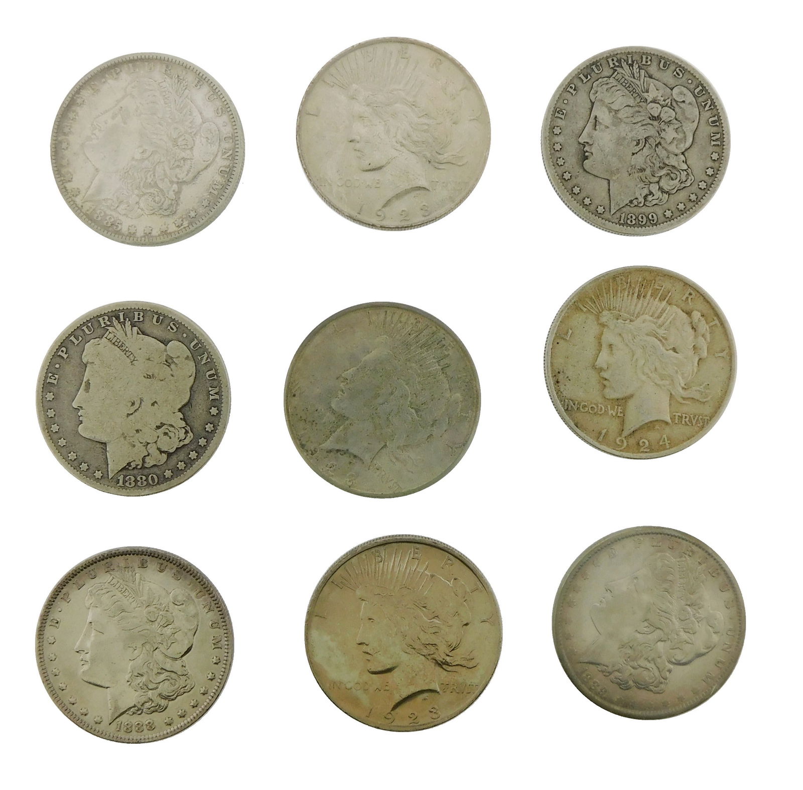 COINS: Nine common date US silver dollars, with dates ranging from 1880 through 1923, grades range (1 of 2)
