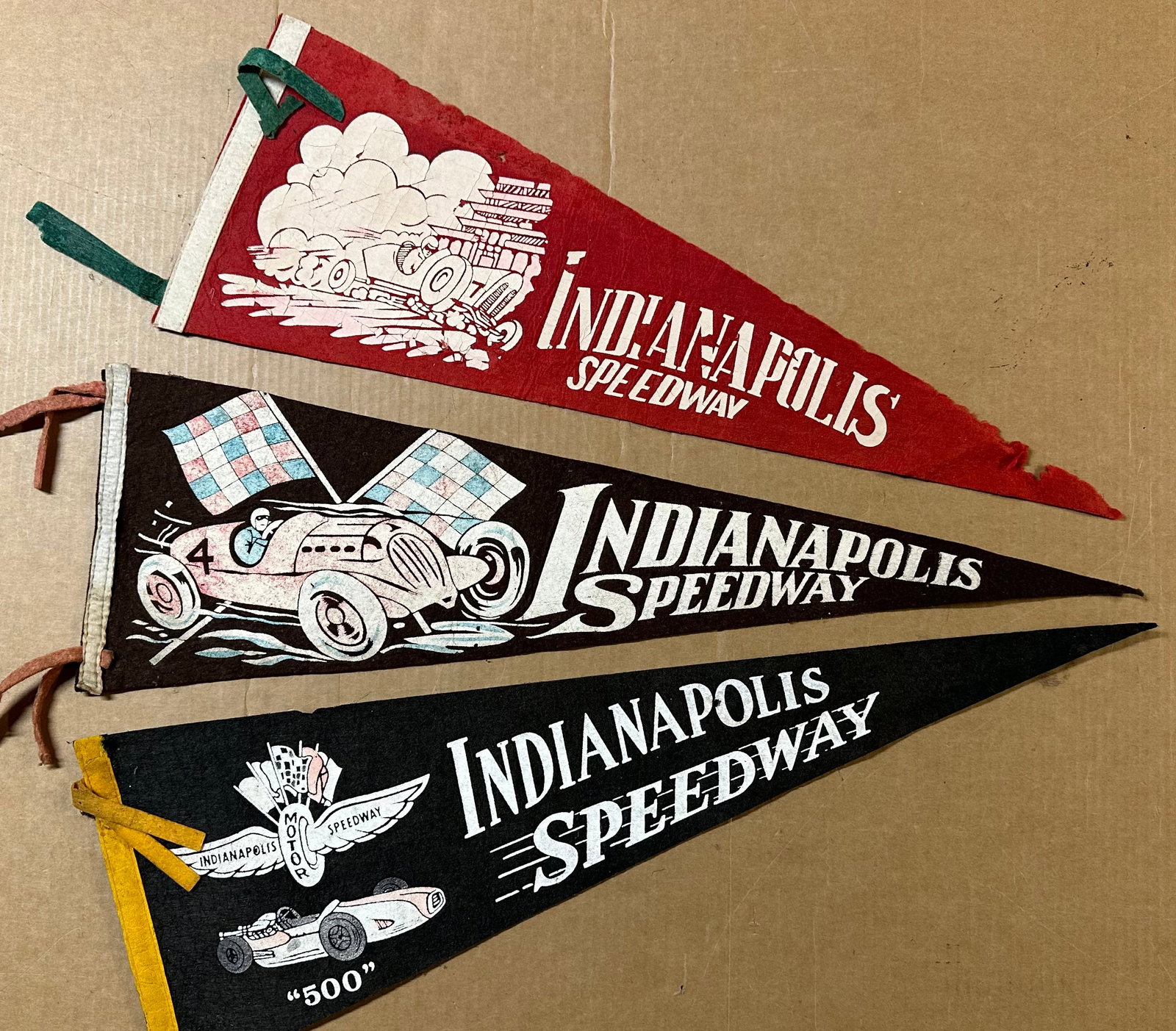 Three Indianapolis Speedway 500 mile race pennants, ca 1940’s - 1950’s, 8.5 x 26 each,: Three Indianapolis Speedway 500 mile race pennants, ca 1940’s - 1950’s, 8.5 x 26 each [NOTE: SHIPPING AND PICK UP APPOINTMENTS ARE HANDLED EXCLUSIVELY BY GERALD LETTIERI OF AUTOMOBILIA AUC