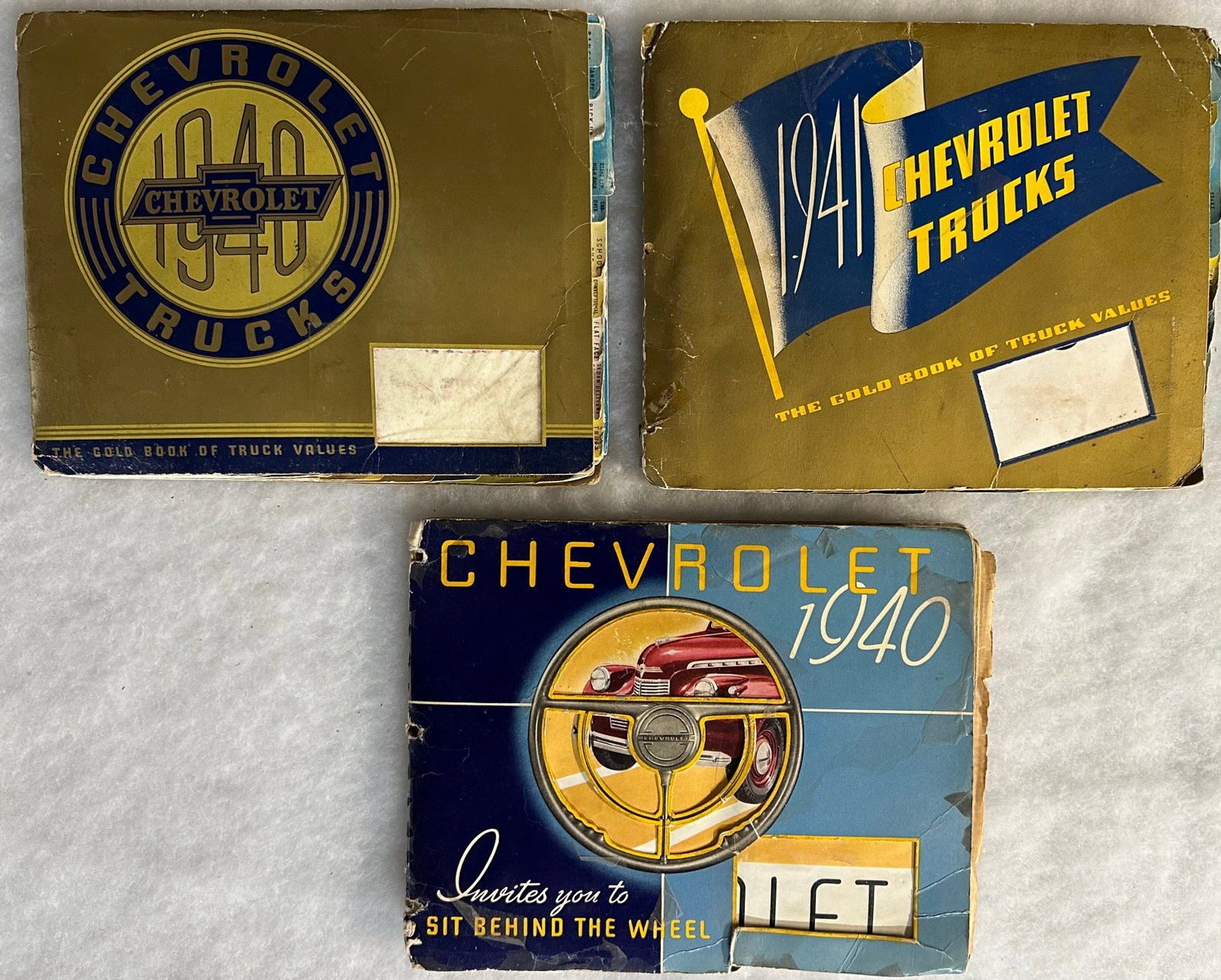 Three Chevrolet dealer albums - 1940 and 1941 full line truck and 1940 full line passenger car, all: Three Chevrolet dealer albums - 1940 and 1941 full line truck and 1940 full line passenger car, all three have some page and binding damage [NOTE: SHIPPING AND PICK UP APPOINTMENTS ARE HANDLED EXCLUSI