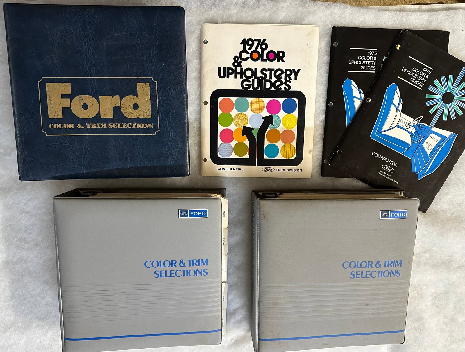 1980 and two 1989 Ford large Color and Trim albums, vg condition, show all passenger cars, Broncos,: 1980 and two 1989 Ford large Color and Trim albums, vg condition, show all passenger cars, Broncos, pickup trucks, three smaller vg Color and Upholstery Guides, 1960, 1968, 1975 trim albums without co