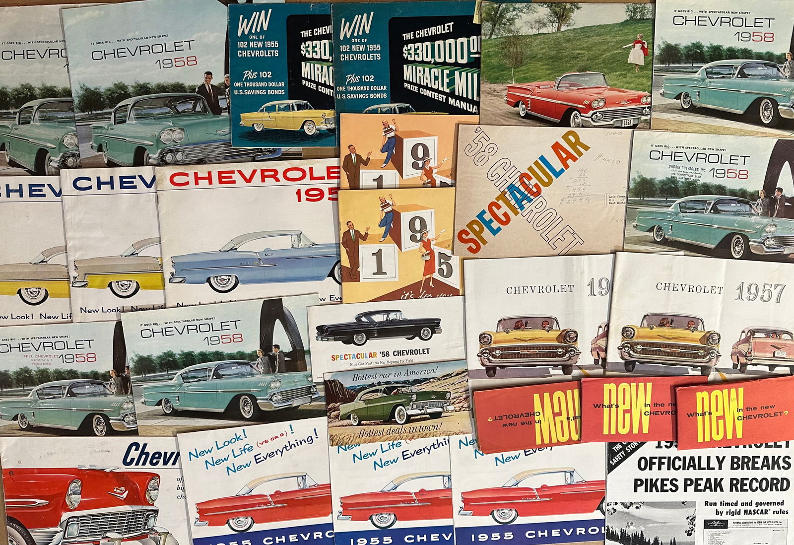 1955 to 1961 Chevrolet and Corvair brochures, sixty four total plus eight 1958 napkins, vg (1 of 3)