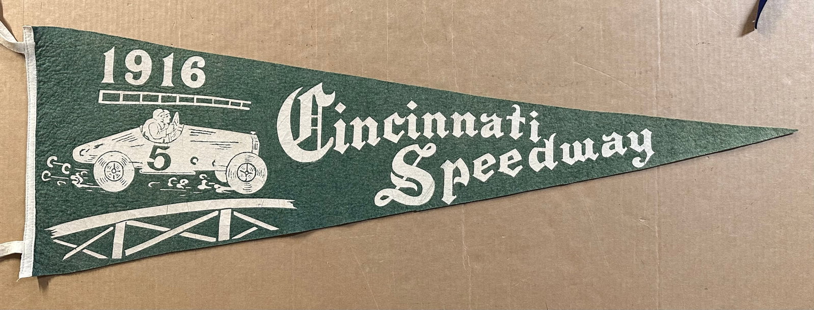 1916 Cincinnati Speedway board track felt pennant, this was a two mile 17 degree bank board track: 1916 Cincinnati Speedway board track felt pennant, this was a two mile 17 degree bank board track from 1916-1919, 35 x 12 [NOTE: SHIPPING AND PICK UP APPOINTMENTS ARE HANDLED EXCLUSIVELY BY GERALD LET
