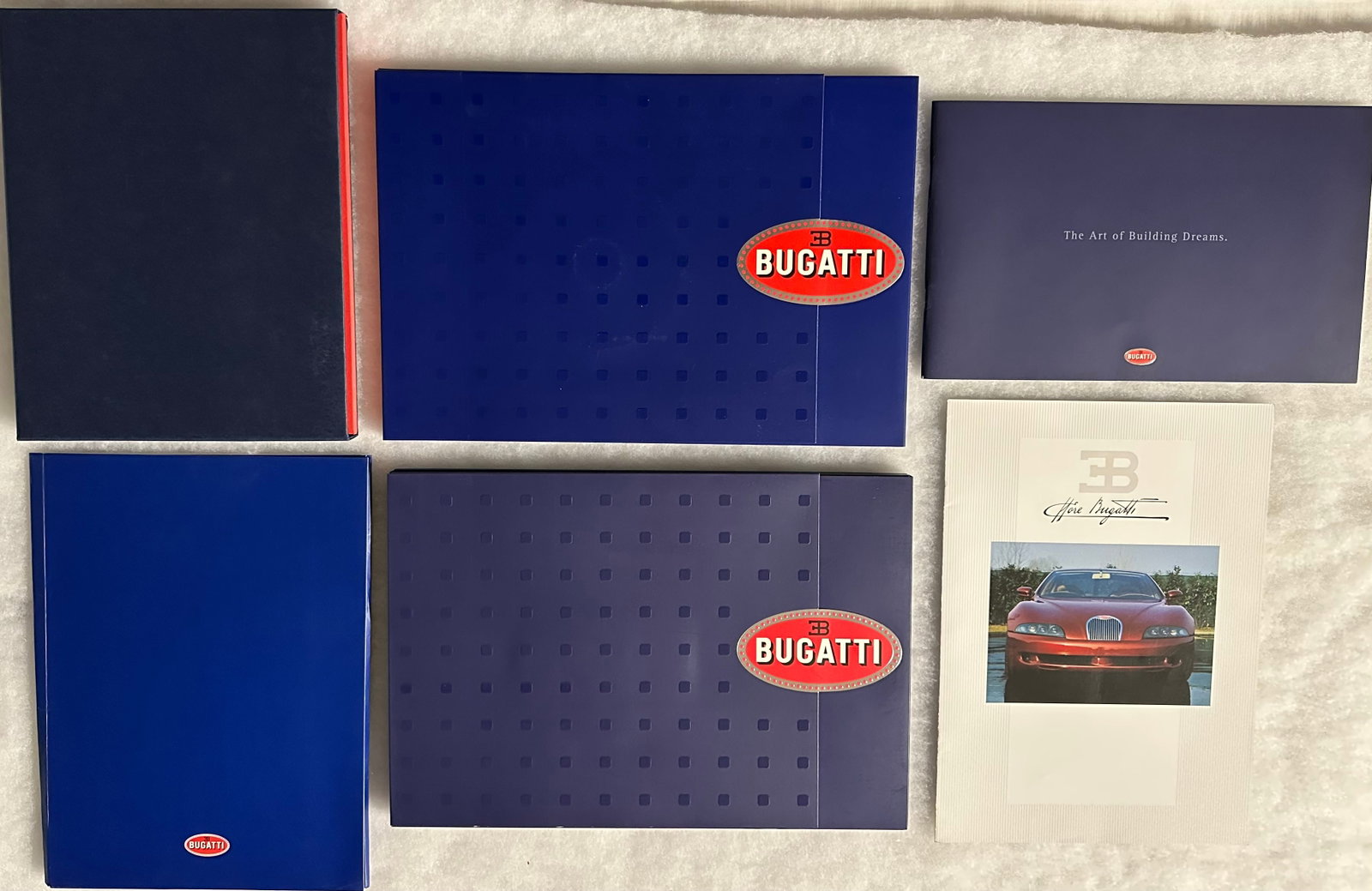 Six Bugatti Veyron prestige brochures - introduced in 2005 - specs include, W 16 cylinder: Six Bugatti Veyron prestige brochures - introduced in 2005 - specs include, W 16 cylinder configuration, 1001 HP, 2.4 seconds 0 to 60, cost $2 million, 450 produced, brochures are in ex condition [NOT
