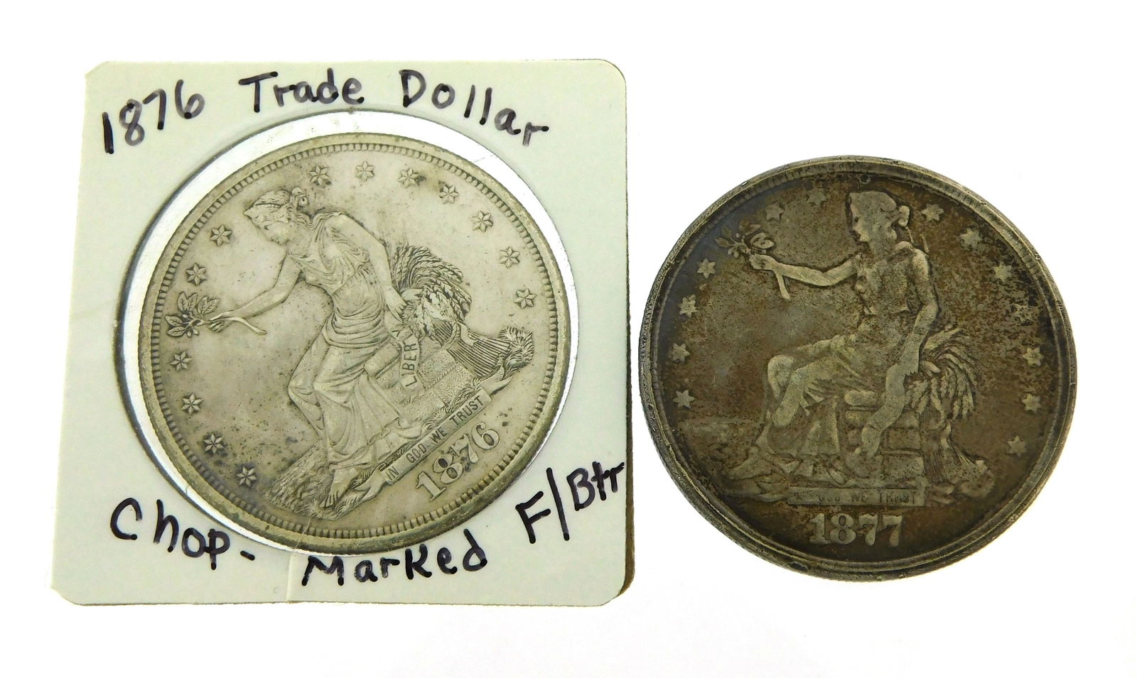 COINS: Two unusual US trade dollars, including an 1876-S with chop mark on the reverse with (1 of 3)