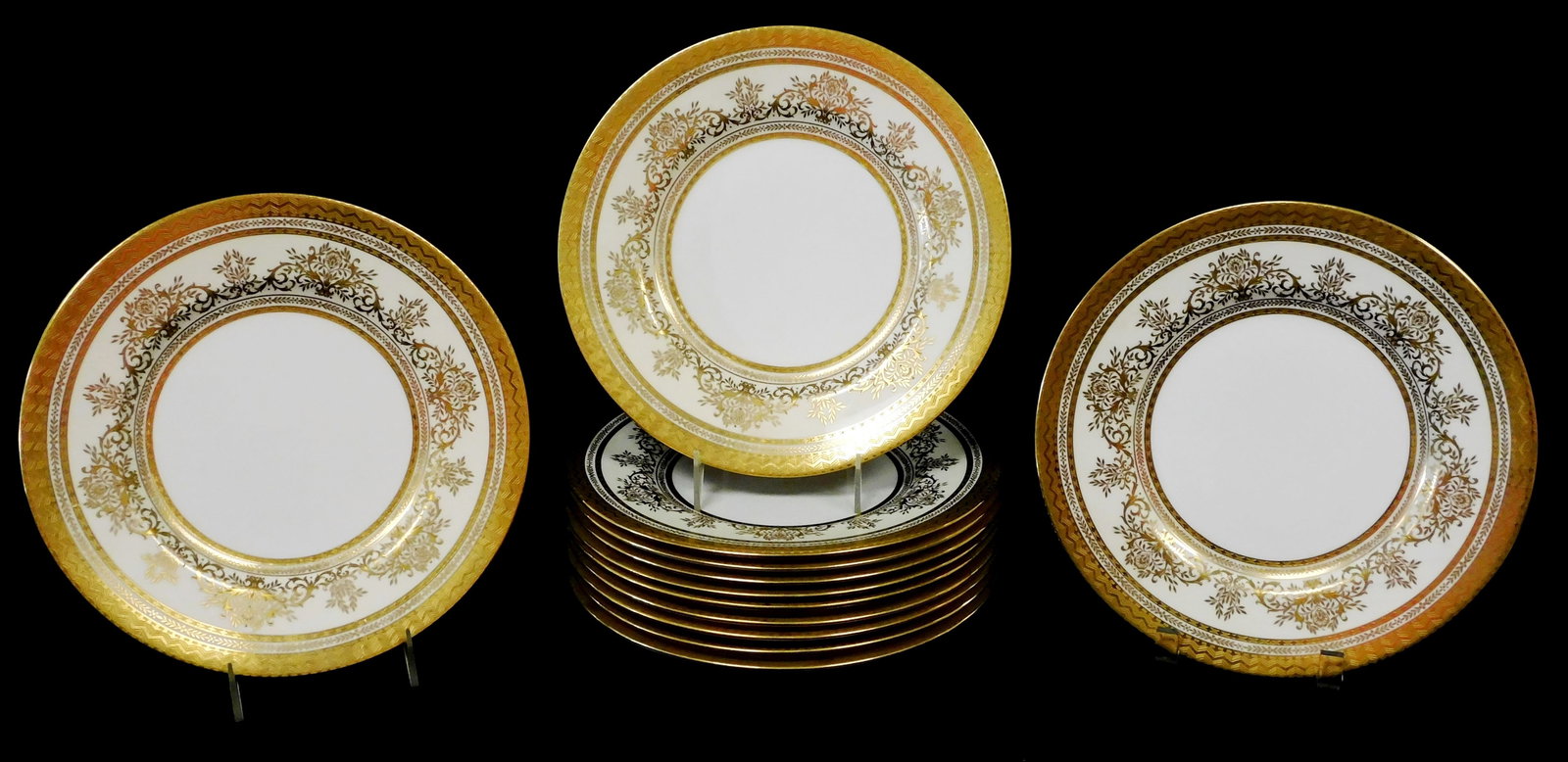 CHINA: Minton porcelain dinner plates, set of twelve, gilt floral and foliate border ensconced by (1 of 3)