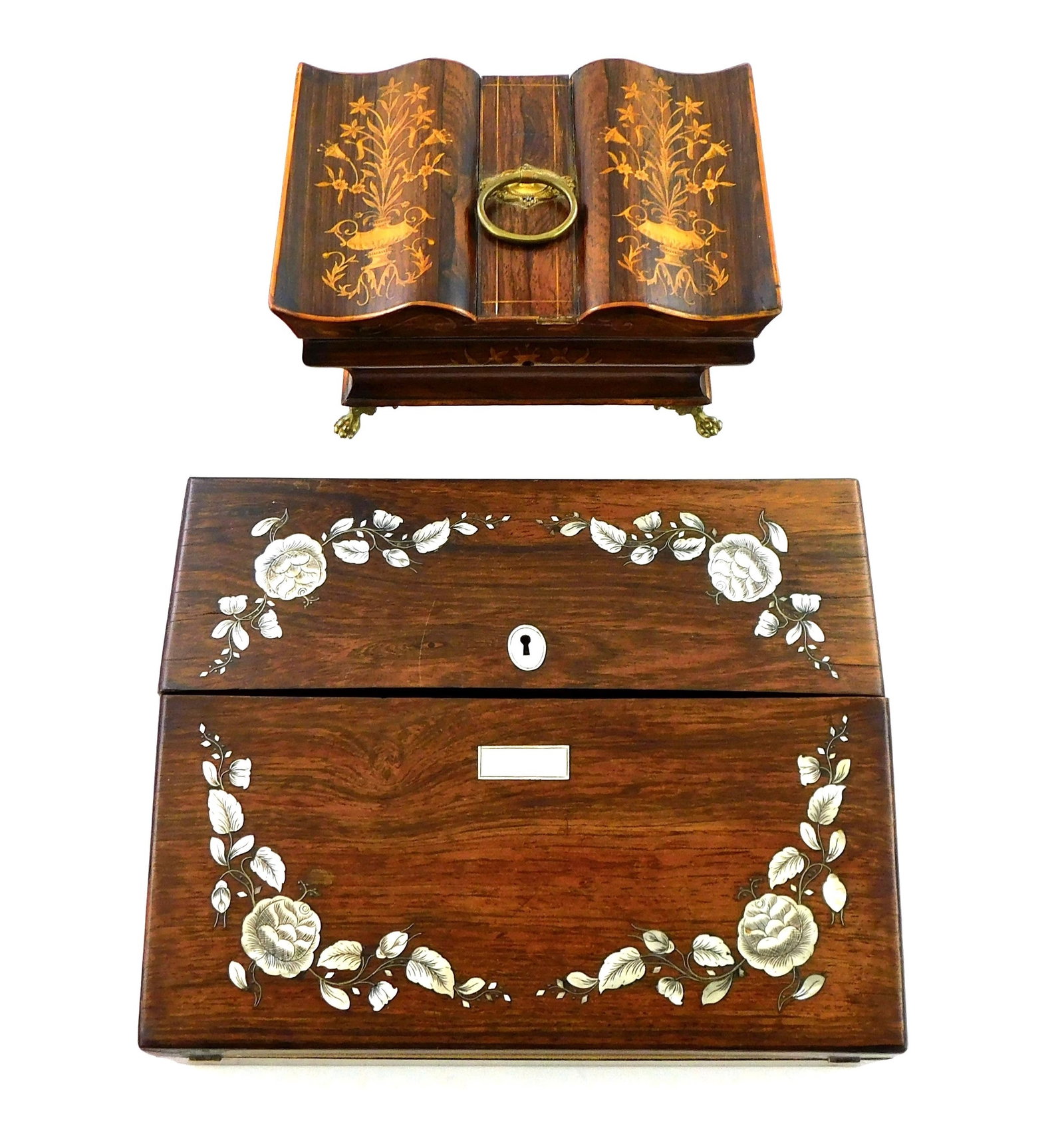 Lap desk and sewing box, both with inlaid designs, late 19th/early 20th C., Rosewood lap desk with: Lap desk and sewing box, both with inlaid designs, late 19th/early 20th C., Rosewood lap desk with mother of pearl inlaid design to top, interior with fabric covered writing surface below a set of eig