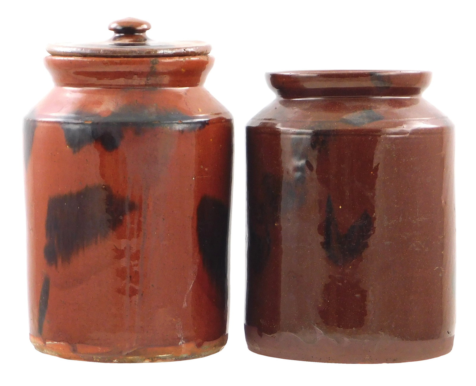 Two 19th C. glazed redware jars, both with manganese decoration, including: lidded jar with: Two 19th C. glazed redware jars, both with manganese decoration, including: lidded jar with manganese splotches, lid with knob grip, wear consistent with age and use, including minor chips/losses of g