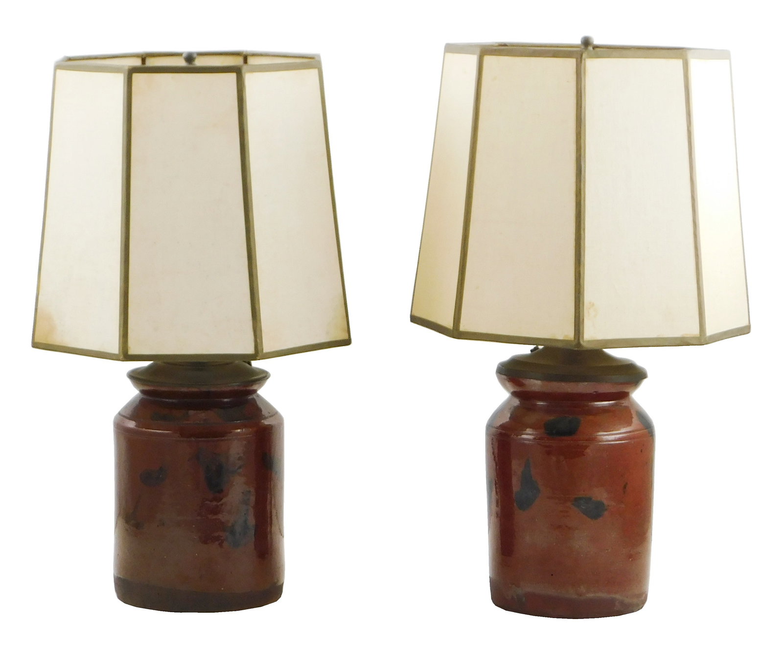 Two redware jars converted to electric lamps, glazed redware jars with manganese splotches, each: Two redware jars converted to electric lamps, glazed redware jars with manganese splotches, each with fastened lighting hardware to top of jars, cords protruding from hardware, jar exterior does not a
