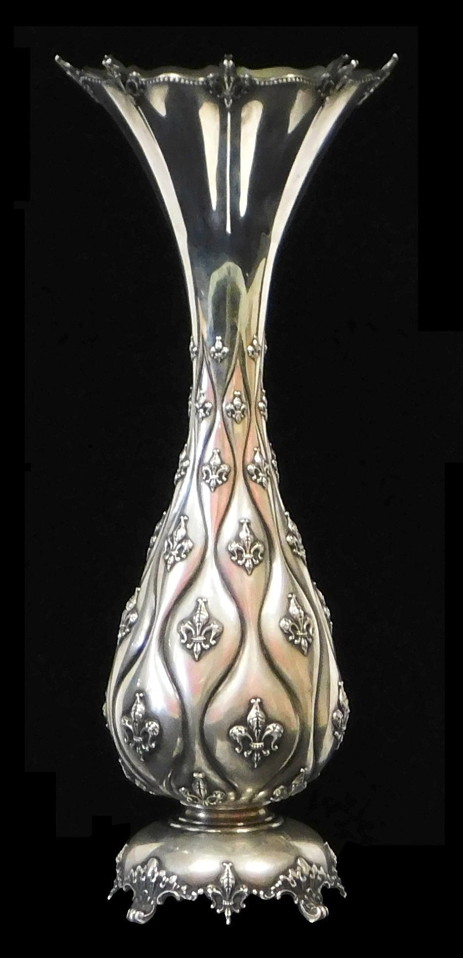STERLING: Tiffany & Co. Makers sterling silver vase, 1914, baluster form with flared and shaped rim,: STERLING: Tiffany & Co. Makers sterling silver vase, 1914, baluster form with flared and shaped rim, repousse undulating vertical lines interspersed with applied fleur de lis, raised on domed foot wit