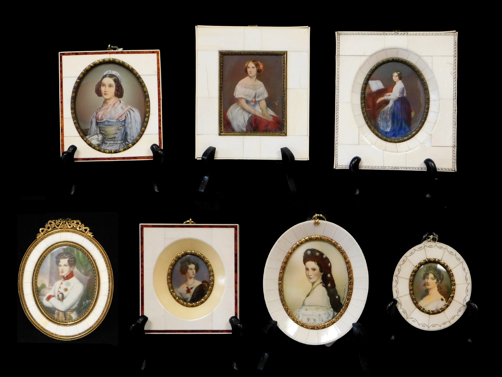 Seven hand painted Continental miniatures in various bone frames, 19th/20th C., details include:: Seven hand painted Continental miniatures in various bone frames, 19th/20th C., details include: woman in white dress with red blanket on her lap, signed “Vi” lower center right; young gentlem