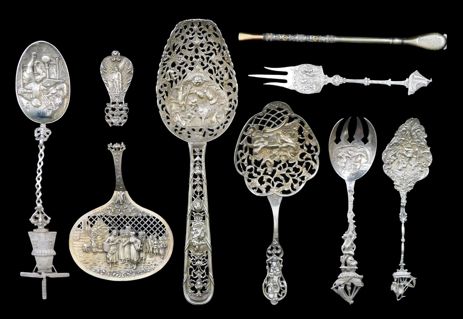 SILVER: Dutch & other decorative serving utensils, 19th C., eight pieces, all with sculptural and: SILVER: Dutch & other decorative serving utensils, 19th C., eight pieces, all with sculptural and figural designs, four with silver hallmarks, including: two lattice servers, one larger with latticewo